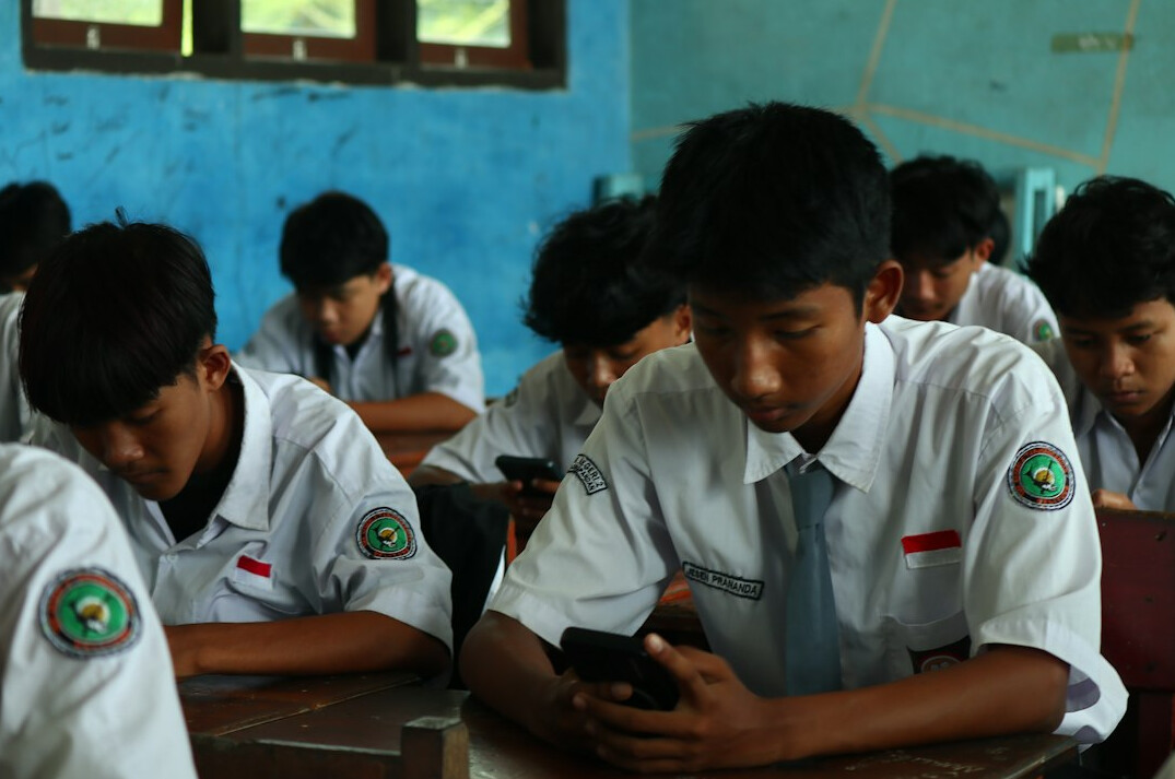 students coding together in classroom