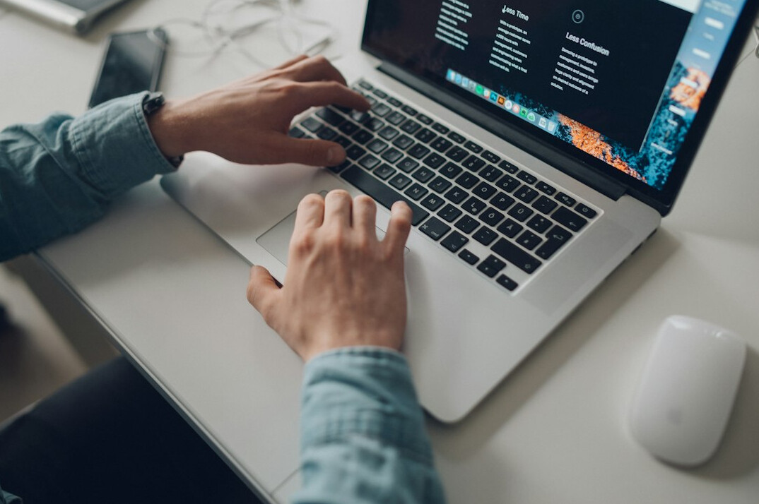 developer building app on laptop